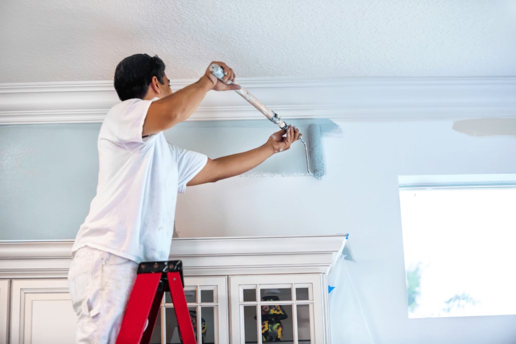 Painter painting interior wall