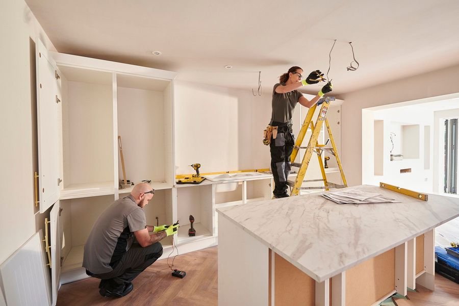 Skilled tradespeople renovating a home interior